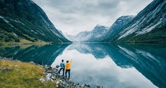 People looking out on a fjord